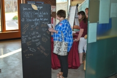 Signing the Bucket List Wall